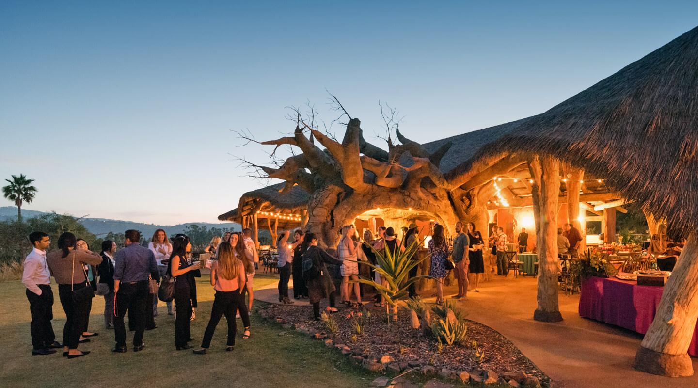 people mingle at Kijamii Overlook at dusk