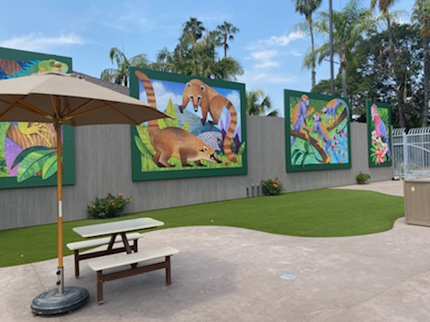 Murals with cutout grass area